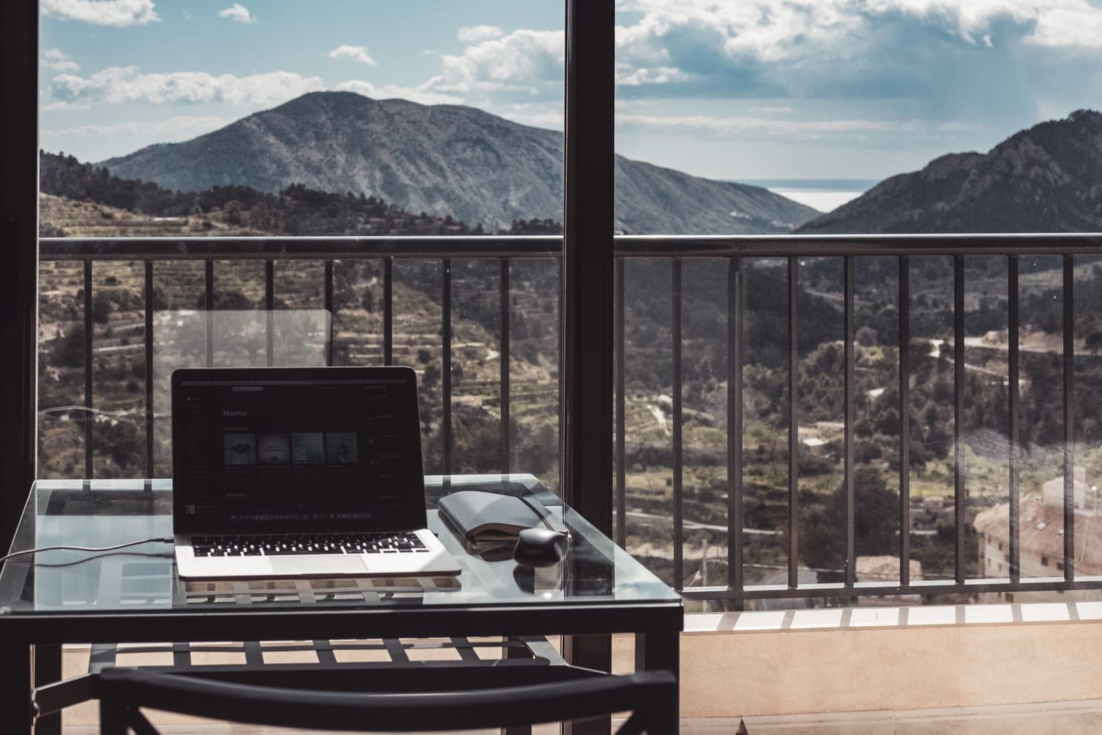 A laptop against a mountain backdrop
